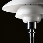 Bergen floor lamp, detail close-up of glass shade and chrome joint
