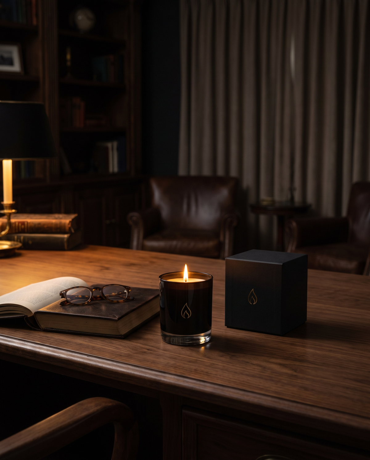 Regent — The Mahogany Teakwood candle styled on a walnut desk